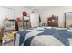 Bedroom featuring a patterned quilt, TV, and storage boxes at 4350 Intercoastal Dr. # 2207, Little River, SC 29566