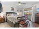 Bedroom featuring a comfortable bed, natural light, and stylish furnishings at 4350 Intercoastal Dr. # 2207, Little River, SC 29566