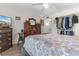 A bedroom featuring a bed, wooden dresser, and closet rack for clothing storage at 4350 Intercoastal Dr. # 2207, Little River, SC 29566