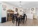 A lovely dining room with a wooden table, decorative cabinet, and a bright ambiance at 4350 Intercoastal Dr. # 2207, Little River, SC 29566