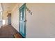 Exterior entryway showcasing a turquoise louvered door with unit number at 4350 Intercoastal Dr. # 2207, Little River, SC 29566