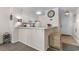 Open concept kitchen with breakfast bar that leads to the entryway at 4350 Intercoastal Dr. # 2207, Little River, SC 29566