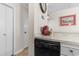 Corner view of kitchen with a white dishwasher and tiled flooring at 4350 Intercoastal Dr. # 2207, Little River, SC 29566