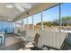 Screened porch with multiple ceiling fans and comfortable seating area at 4350 Intercoastal Dr. # 2207, Little River, SC 29566