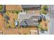 A lovely aerial view of the property showcasing the roof, patio, fenced backyard, and surrounding community at 4517 Planters Row Way, Myrtle Beach, SC 29579