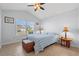 Bedroom with tile floors, a ceiling fan and a window view of the neighborhood at 4517 Planters Row Way, Myrtle Beach, SC 29579