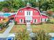Charming red clubhouse with white trim and well-maintained landscaping at 4517 Planters Row Way, Myrtle Beach, SC 29579