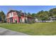 Community building with a pool area and large grassy lawn with trees at 4517 Planters Row Way, Myrtle Beach, SC 29579
