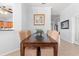 Elegant dining room features a wood table with seating for eight and a decorative wall painting at 4517 Planters Row Way, Myrtle Beach, SC 29579