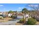 Beautiful brick home with an attached two-car garage, a landscaped yard and mature landscaping at 4517 Planters Row Way, Myrtle Beach, SC 29579