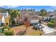 Charming single-story brick home with a two-car garage, a landscaped lawn and mature trees at 4517 Planters Row Way, Myrtle Beach, SC 29579