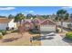 Beautiful brick home with mature landscaping, a two-car garage, and a well-maintained lawn at 4517 Planters Row Way, Myrtle Beach, SC 29579