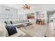 Spacious living room with fireplace, TV, dining area, kitchen, and a large sectional sofa at 4517 Planters Row Way, Myrtle Beach, SC 29579