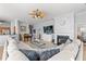 Bright living area with a fireplace, TV, ceiling fan and a large sectional sofa for relaxing at 4517 Planters Row Way, Myrtle Beach, SC 29579