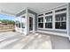 Spacious screened back porch with concrete flooring and multiple windows that allow natural light at 5501 Bristle Cone Ct., Myrtle Beach, SC 29577