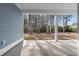Expansive back porch with a tranquil view of the surrounding trees and open backyard at 5501 Bristle Cone Ct., Myrtle Beach, SC 29577