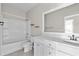 Bathroom featuring a tub, toilet, and a white vanity with sink and mirror at 5501 Bristle Cone Ct., Myrtle Beach, SC 29577