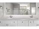 Bathroom featuring a double sink vanity and walk-in shower with a glass door at 5501 Bristle Cone Ct., Myrtle Beach, SC 29577
