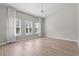 Bright bedroom with plantation shutters, wood-look flooring, and neutral paint at 5501 Bristle Cone Ct., Myrtle Beach, SC 29577