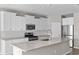 Modern kitchen featuring white cabinets, stainless steel appliances, granite countertops, and subway tile backsplash at 5501 Bristle Cone Ct., Myrtle Beach, SC 29577