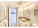 Bathroom with vanity, granite countertop, framed mirror, and a view into a secondary bathroom at 5523 N Ocean Blvd. # 1513, Myrtle Beach, SC 29577