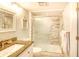 Bathroom features a modern sink, granite countertops, and a shower with elegant tile and glass door at 5523 N Ocean Blvd. # 1513, Myrtle Beach, SC 29577