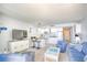 Open living area with a view into the kitchen featuring a bar, comfortable seating, and beach-themed decor at 5523 N Ocean Blvd. # 1513, Myrtle Beach, SC 29577