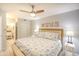 Serene main bedroom with a king-size bed, ceiling fan, and beach-themed decorations, creating a relaxing ambiance at 5523 N Ocean Blvd. # 1513, Myrtle Beach, SC 29577