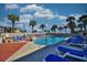 Outdoor pool area offers plenty of lounge chairs and palm trees for a relaxing experience at 5523 N Ocean Blvd. # 1513, Myrtle Beach, SC 29577
