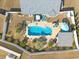Aerial view of the home's backyard featuring a pool, hot tub, patio, and tropical landscaping at 556 Cedar Lakes Dr., Little River, SC 29566