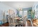 Dining room with coastal accents, bright light, and an elegant chandelier at 556 Cedar Lakes Dr., Little River, SC 29566