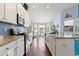 Bright kitchen featuring granite countertops, modern appliances, and a stylish backsplash at 556 Cedar Lakes Dr., Little River, SC 29566