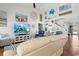 Bright and airy living room with a high ceiling, coastal decor, and a ceiling fan at 556 Cedar Lakes Dr., Little River, SC 29566