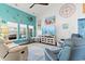 Cozy coastal-themed living room with comfortable seating, bright decor, and natural light at 556 Cedar Lakes Dr., Little River, SC 29566
