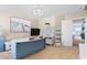 Office space with a blue desk, white storage shelves, and a beach themed art at 556 Cedar Lakes Dr., Little River, SC 29566