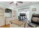 Office with a large desk, shelves, big chair and bright light at 556 Cedar Lakes Dr., Little River, SC 29566