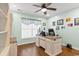 Office with a large desk, shelves, big chair and bright light at 556 Cedar Lakes Dr., Little River, SC 29566
