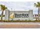 Entrance to Barefoot Resort & Golf features an elegant monument sign and palm trees at 5801 Oyster Catcher Dr. # 723, North Myrtle Beach, SC 29582