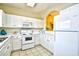 Functional kitchen with white cabinetry and modern appliances, offering a clean and efficient cooking space at 5801 Oyster Catcher Dr. # 723, North Myrtle Beach, SC 29582