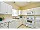 Well-lit kitchen with white cabinets, modern appliances, and a convenient design for cooking and entertaining at 5801 Oyster Catcher Dr. # 723, North Myrtle Beach, SC 29582