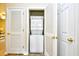 Conveniently located laundry area featuring stacked washer and dryer at 5801 Oyster Catcher Dr. # 723, North Myrtle Beach, SC 29582