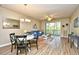 Open concept living room and dining area with sliding glass door to patio and modern decor at 5801 Oyster Catcher Dr. # 723, North Myrtle Beach, SC 29582