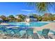 A view of the outdoor community pool with lounge chairs and clear blue skies at 5801 Oyster Catcher Dr. # 723, North Myrtle Beach, SC 29582
