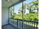 Relaxing screened porch with views of mature trees and lush landscaping at 5801 Oyster Catcher Dr. # 723, North Myrtle Beach, SC 29582