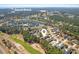 Aerial view of houses in a neighborhood, located next to a golf course and near Sunset Beach at 598 Summer Green Ct., Sunset Beach, NC 28468