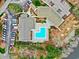 Aerial shot of community pool and clubhouse, with ample parking and beautiful landscaping at 598 Summer Green Ct., Sunset Beach, NC 28468