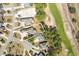 Aerial view of a well-maintained property next to a golf course and new construction site at 598 Summer Green Ct., Sunset Beach, NC 28468
