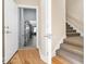 Bright entryway featuring hardwood floors and easy access to the garage and carpeted stairs at 598 Summer Green Ct., Sunset Beach, NC 28468