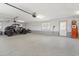 Spacious garage with epoxy flooring offering ample storage and parking space for vehicles at 598 Summer Green Ct., Sunset Beach, NC 28468