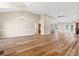 Spacious living room with hardwood floors, high ceilings, a chandelier, and natural light at 598 Summer Green Ct., Sunset Beach, NC 28468